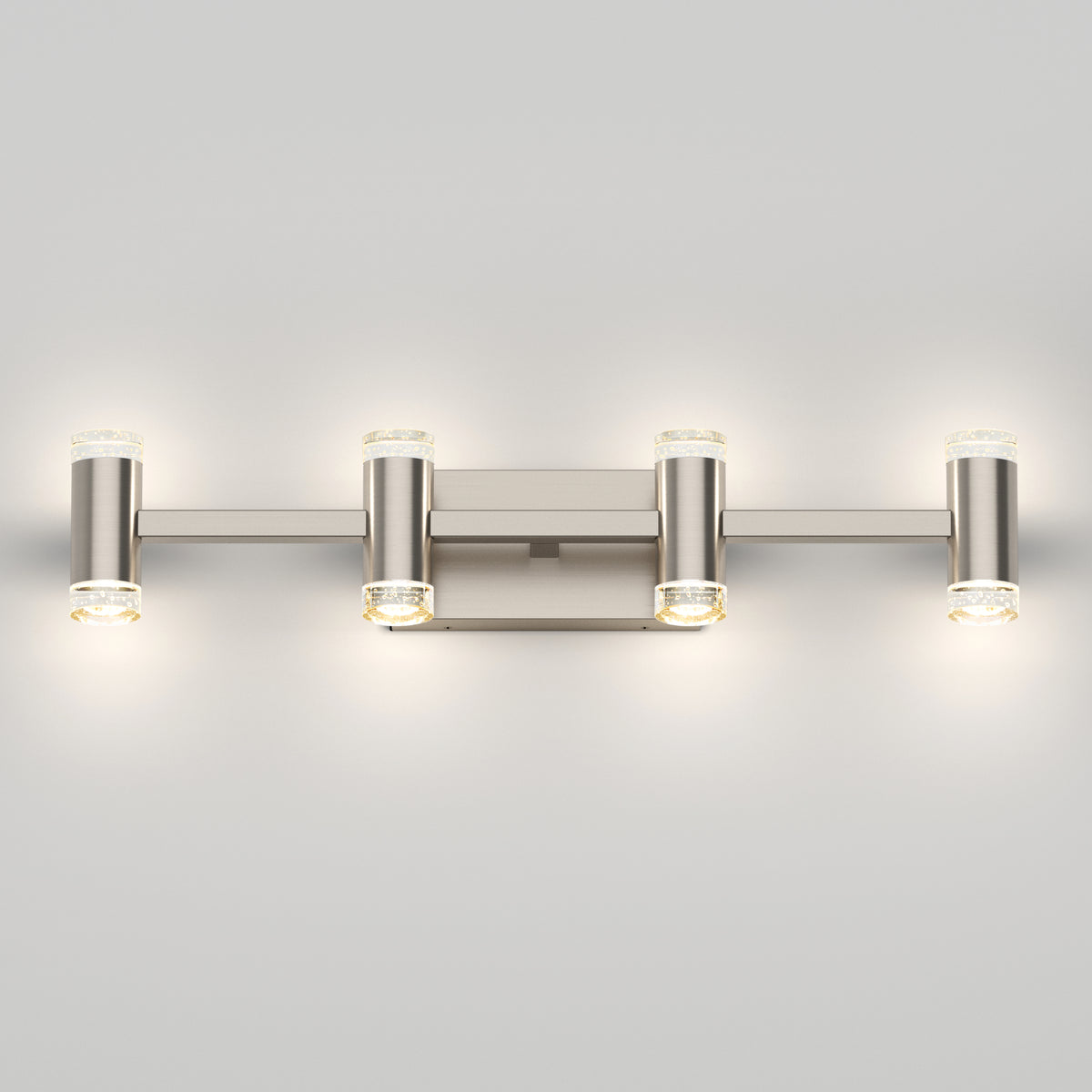 The Artika Mist modern LED bathroom vanity light 5 CCT features a brushed metal finish with four horizontal cylindrical lights on a rectangular base, offering adjustable color temperatures—perfect for stylish, soft bathroom lighting.