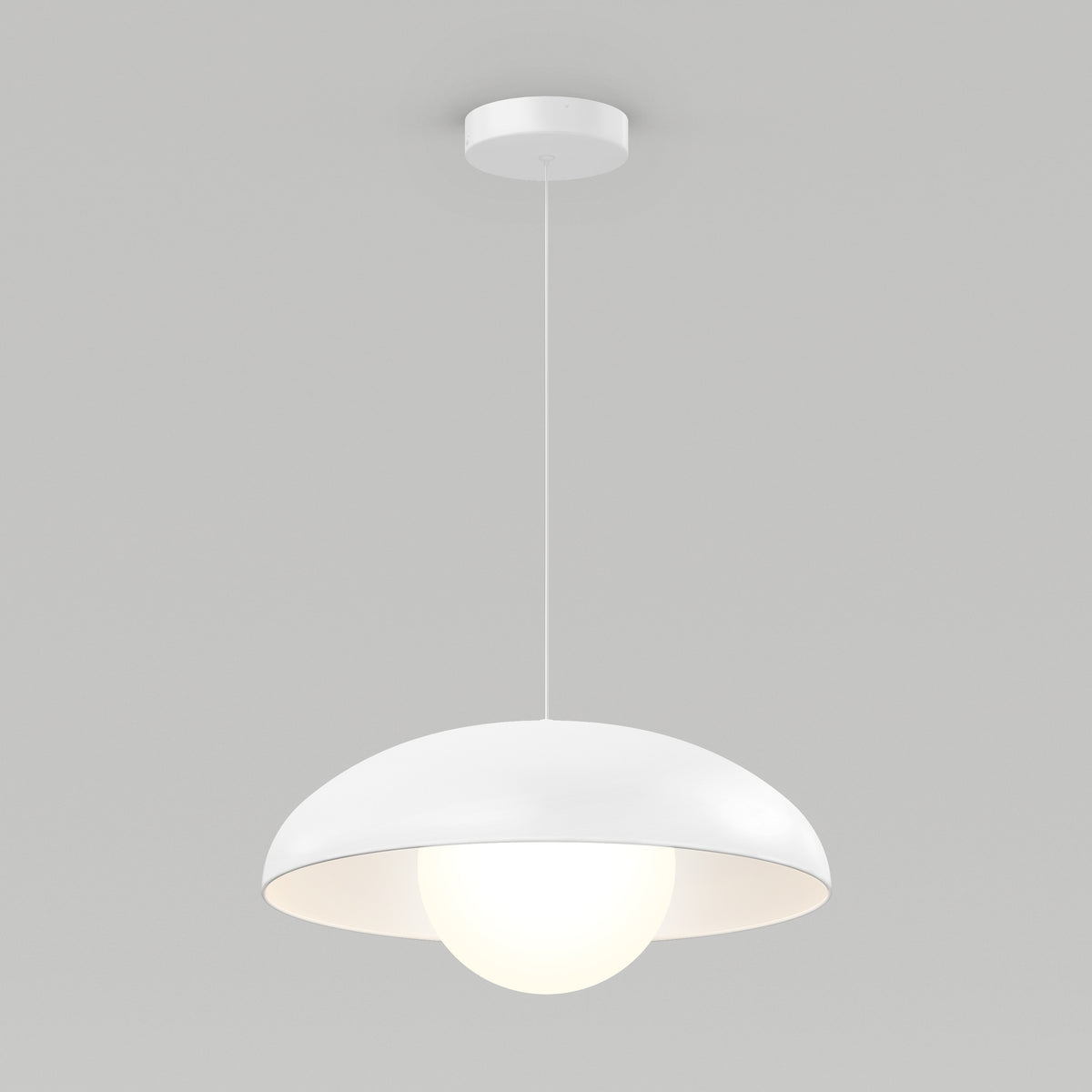 The Artika Boden LED modern mid-century pendant light 3 CCT features a dome-shaped white shade and hangs by a thin cord, showcasing a glowing spherical bulb against a plain light gray background.