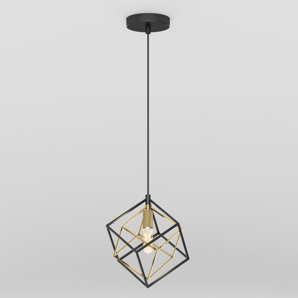 The Artika Imperium Single pendant light features a modern black and gold cube-shaped metal frame, an exposed bulb, and hangs from a black cord with a matching ceiling mount.