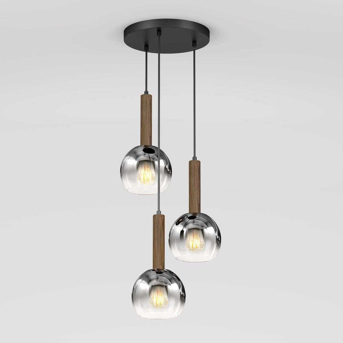 The Artika Ardel Spiral 3-Light Pendant features three hanging lights with round, transparent glass shades and wooden accents, all suspended from a circular black base. Bulbs are not included.