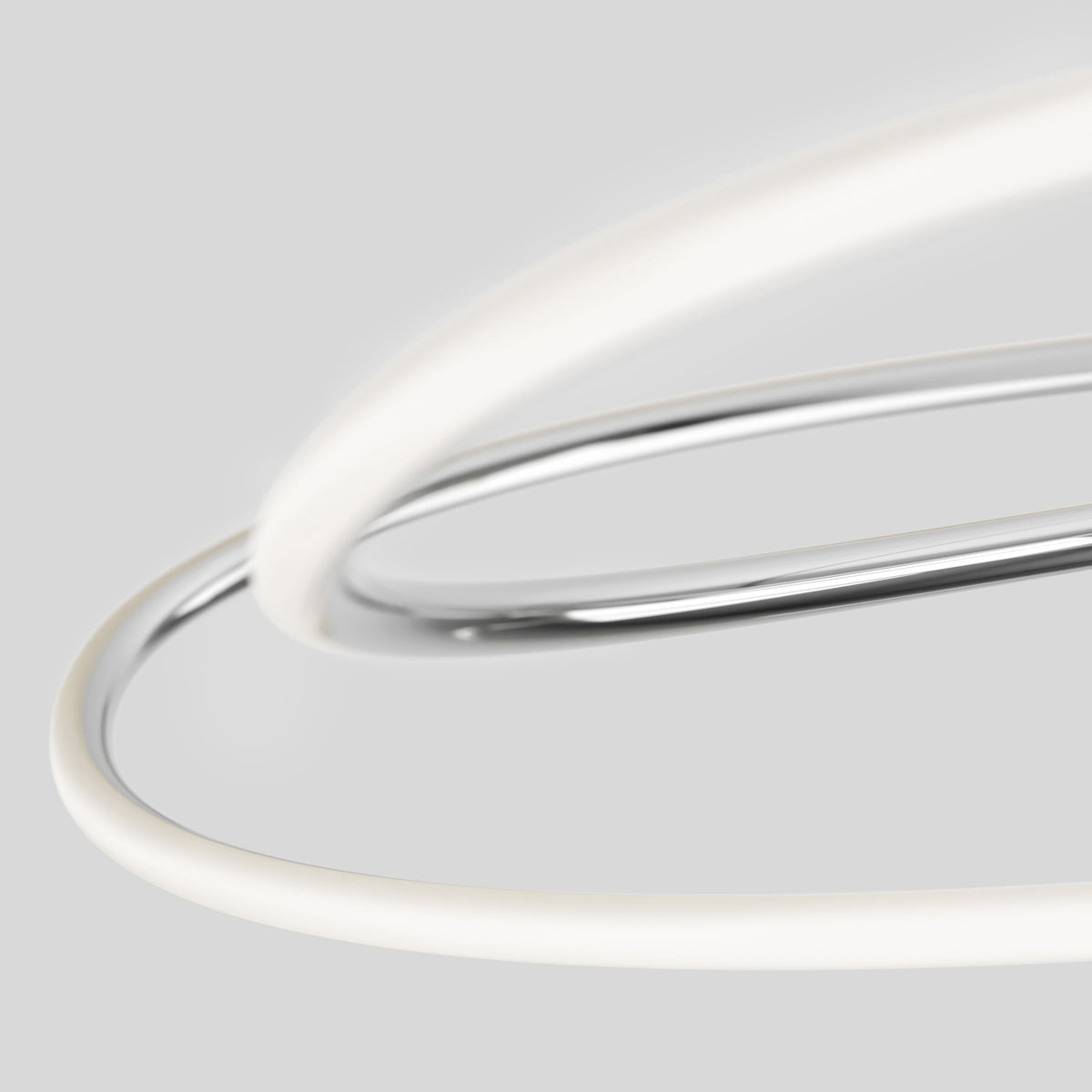 The Artika Swirl Butterfly LED contemporary pendant light features metallic and white tubes that intertwine against a plain light gray background, forming an abstract, minimalist design.