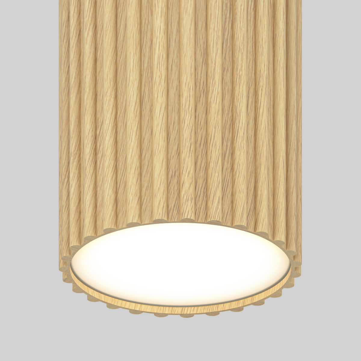 The Artika Groove LED modern pendant light 3 CCT features a cylindrical textured wood finish with vertical grooves, casting bright white light from the base—ideal for kitchen islands against a plain light gray backdrop.