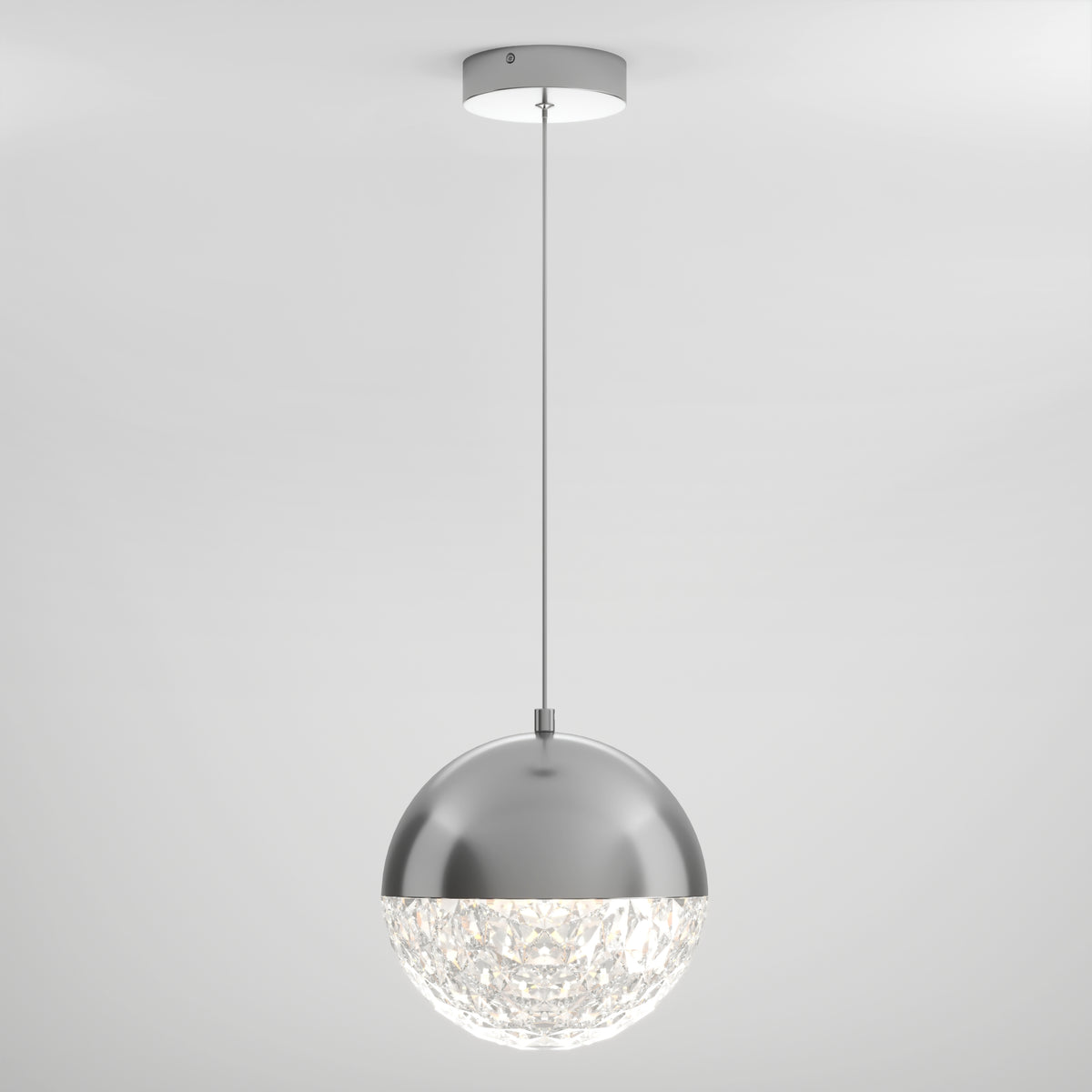 The Artika Carat LED pendant light 3 CCT features a modern silver metallic dome with a textured clear lower half, suspended by a thin black cord against a plain white background.