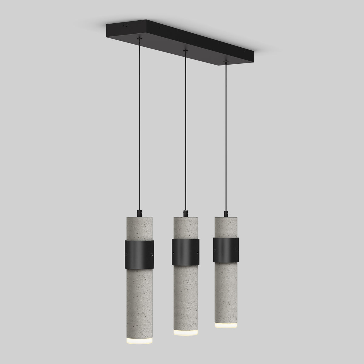 The Artika Barden 3-light LED pendant features three cylindrical concrete lampshades suspended from a black rectangular ceiling mount by slim black cords, shown here against a plain light gray background.