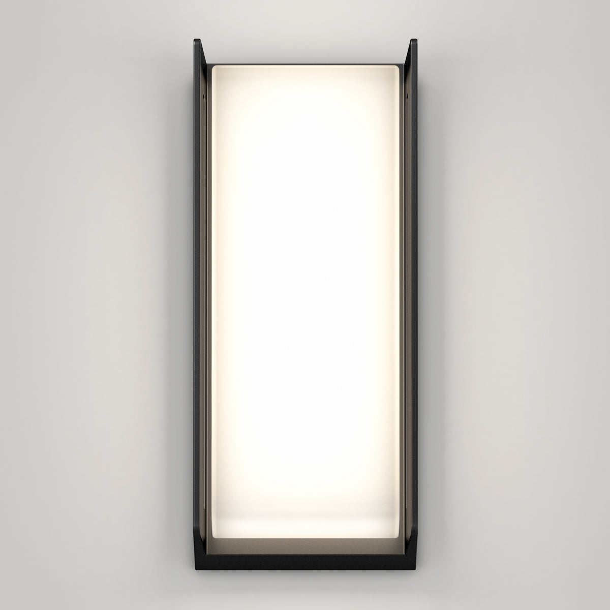 The Artika Ryker smart RGB indoor-outdoor wall light features a black frame and softly glowing white center, mounted on a plain light gray wall.