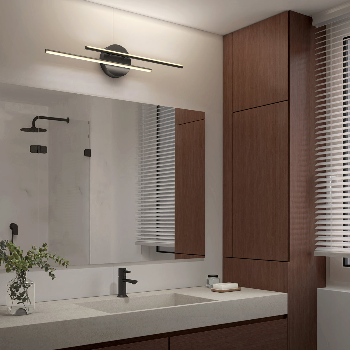 Modern bathroom with a large mirror, wood cabinets, white double-sink countertop, black faucet, small plant, and an Artika Cisco 27-in Integrated LED 5-CCT Vanity Light Bar above the mirror. Window on the right is covered with blinds.