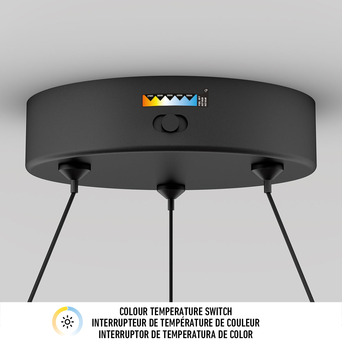 The Artika Bjorn modern LED pendant light 5 CCT is a round black ceiling fixture with three hanging cords and a top color temperature switch, offering customizable warm to cool settings. Below, COLOUR TEMPERATURE SWITCH appears in three languages.
