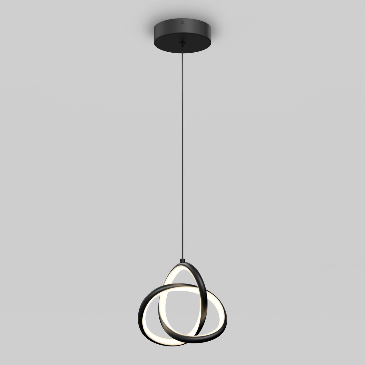 The Artika Zephyr LED pendant features two interlocking black rings with integrated LEDs, suspended by a thin black cord from a round ceiling mount, shown against a plain gray background.