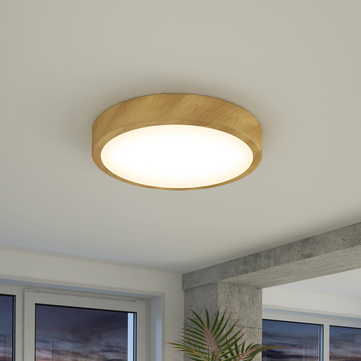The Artika Dryad 15 in. LED Modern flush mount light with a wooden frame is mounted on a white ceiling in a bright room with large windows and a plant, highlighting minimalist style.