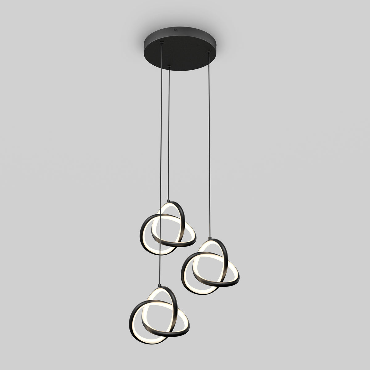 The Artika Zephyr 3-light LED pendant showcases three intertwined circular LED rings hanging at varied heights from a round black base, creating a modern look.