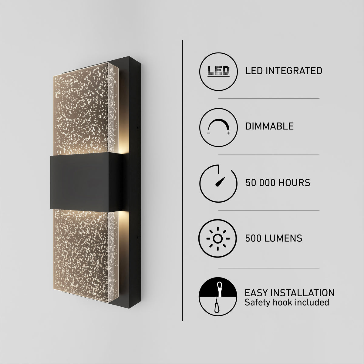 The Artika Mazza Bubble indoor-outdoor LED wall light features a rectangular speckled illuminated glass panel and black center. Icons and text show: LED integrated, dimmable, 50,000 hours, 500 lumens, easy installation.