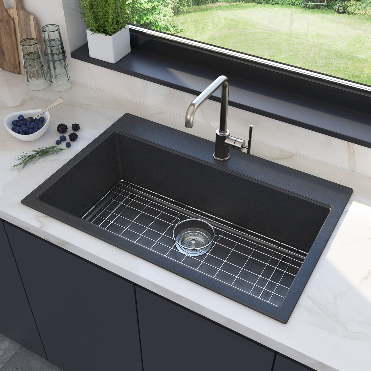 Artika Baycrest 31 in. Modern Sink with metal grid under window; blueberries and rosemary on the white countertop.