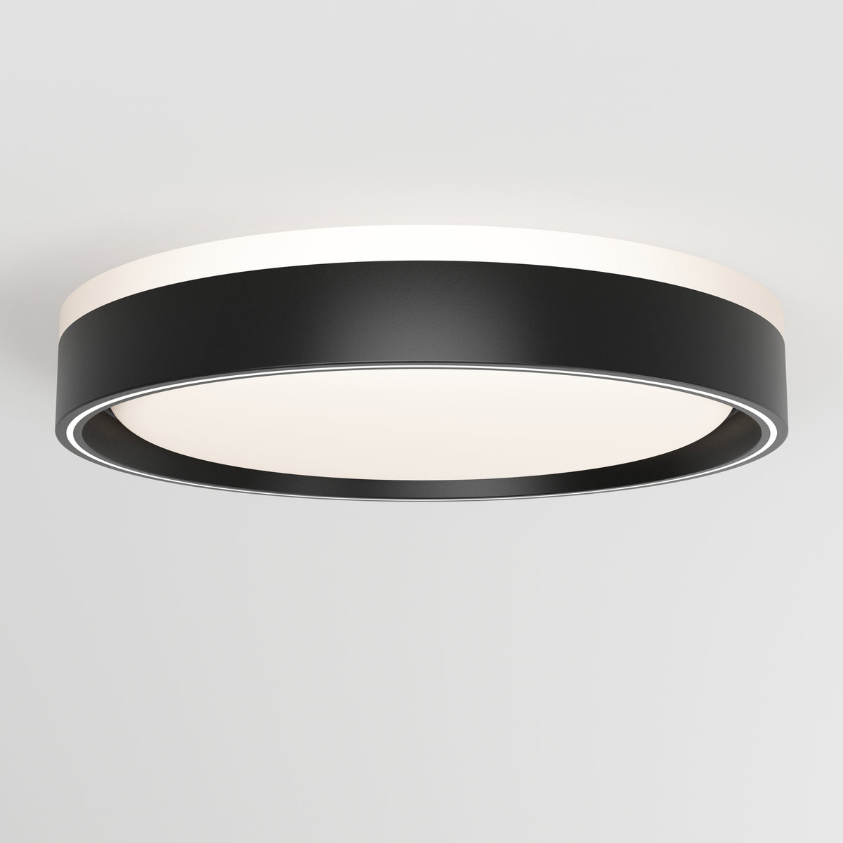 The Artika Callisto 15 in. LED flush mount light features a modern circular design with a black outer rim and white illuminated center, seamlessly mounted on a plain white ceiling.