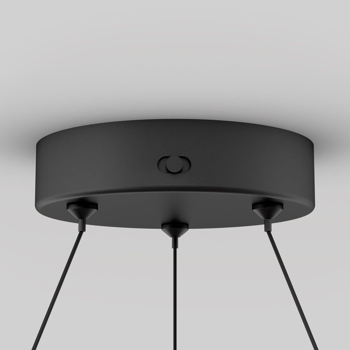 Close-up of the Artika Bjorn modern LED pendant light 5 CCTs round matte black ceiling mount with three black cords, shown against a plain light gray background.
