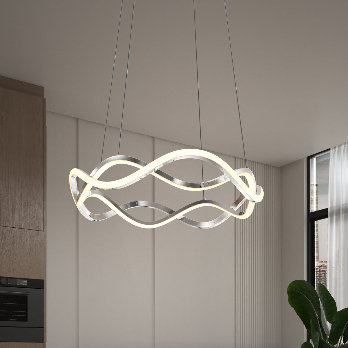 The Artika Vanora LED pendant light, featuring intertwined metallic and illuminated loops, hangs in a contemporary room with neutral walls, wood cabinetry, and a large window with sheer curtains.