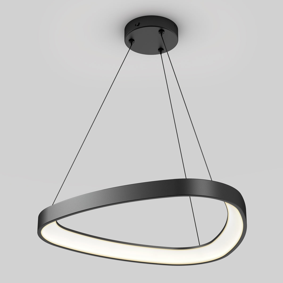 The Artika Bjorn modern LED pendant light 5 CCT features a black asymmetrical ring design with built-in LEDs, suspended by three thin cables from a circular ceiling mount, shown against a plain gray background.