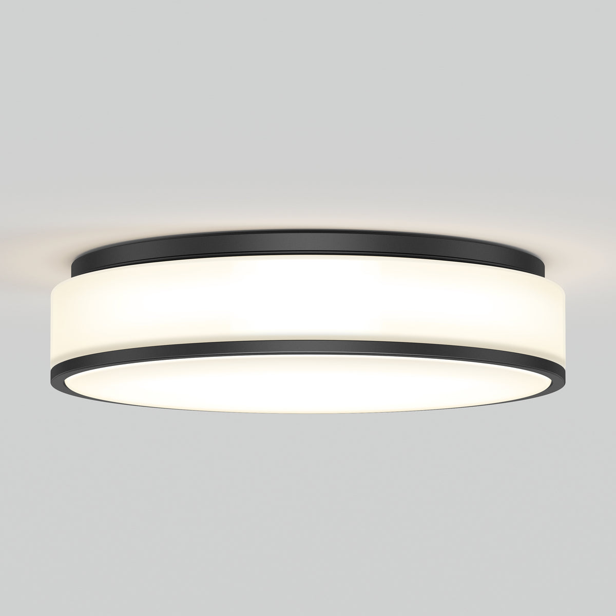 The Artika Giada 15 in. LED modern flush mount light features a black metal trim and frosted white diffuser, providing a soft, even glow on a plain light gray ceiling.
