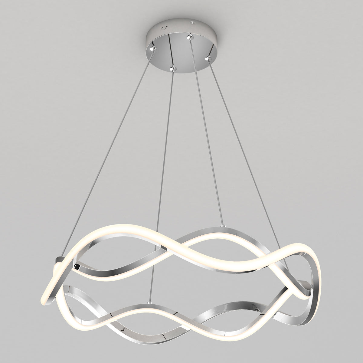 The Artika Vanora LED pendant light 5 CCT features a circular chrome base and four cables suspending an intertwined, wave-shaped LED design with metallic accents, set against a plain light gray background.