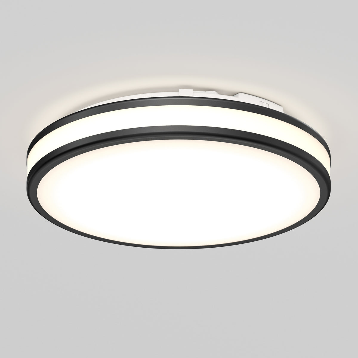 The Artika Hemisphere 15 in. LED Flush Mount, 5 CCT, is ideal for bathrooms with light gray ceilings and features sleek black trim.