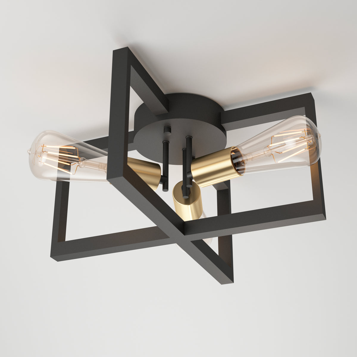 The Artika Holt 3-light flush mount features a geometric black metal frame, gold sockets, and three exposed bulbs, installed on a white ceiling.