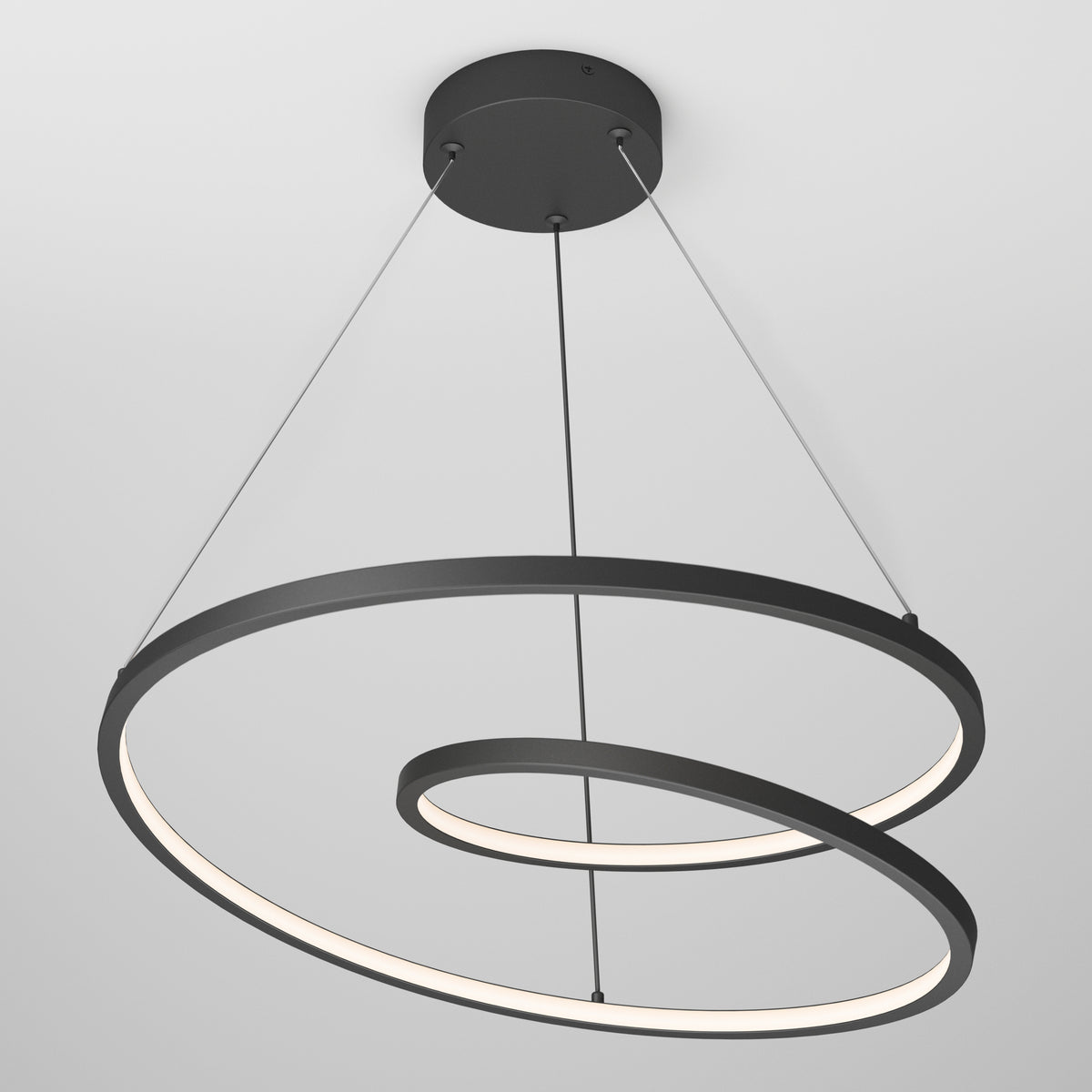 The Artika Salto LED pendant light showcases a spiral design with a black frame and a continuous inner glowing strip, suspended from the ceiling by three thin cables.