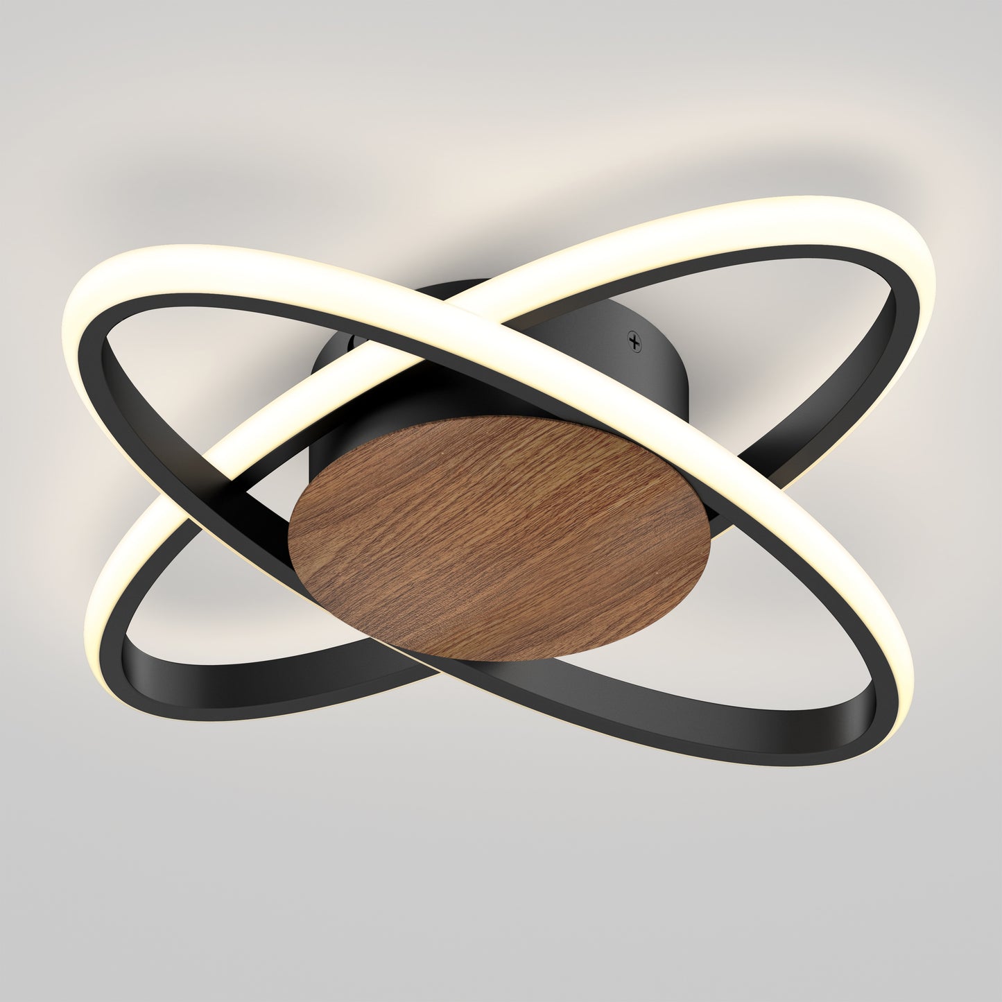 The Artika Atomic 15 in. LED flush mount light features two intersecting black rings with LEDs and a circular wooden center, all mounted on a black base, creating a modern look against a white ceiling. Includes 5 CCT options.