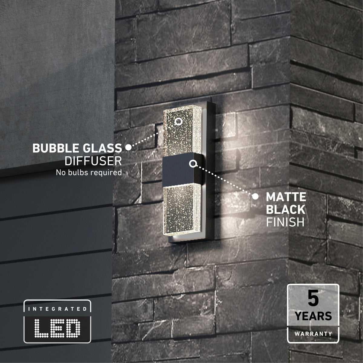 The Artika Mazza Bubble indoor-outdoor LED wall light, featuring a bubble glass diffuser and matte black finish, is shown mounted on a dark brick wall with highlighted features and a 5 years warranty badge in the corner.