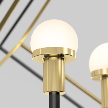 A close-up of the Artika Peyton LED modern mid-century pendant light features a frosted glass globe shade and brass base, set against a neutral background with geometric metal lines.