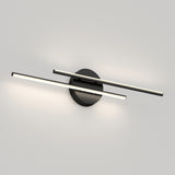 A modern wall light fixture with two slim, horizontal LED bars crossing over a round black base, mounted on a plain light gray wall. The fixture emits soft white light in both directions.
