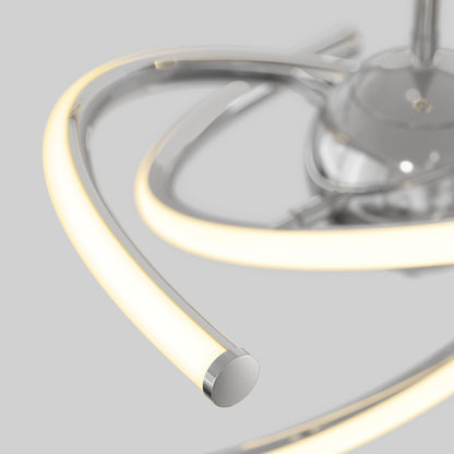 Close-up of the Artika Silvio LED pendant light 3 CCT, featuring curved, glowing arms in a metallic finish, shown against a plain light gray background.