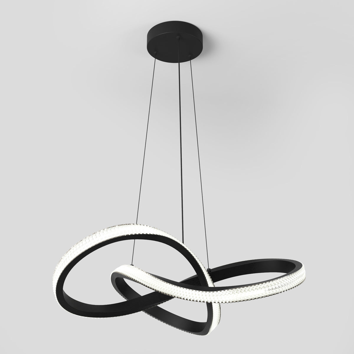 The Morgan LED contemporary pendant light by Artika features intertwining black and white illuminated loops, suspended from a black ceiling mount by three cables, creating a modern sculptural look.