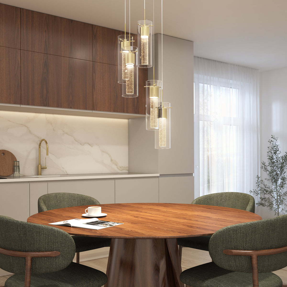 Modern dining area with a round wooden table, four green upholstered chairs, marble backsplash, wood cabinets, gold faucet, hanging glass pendant lights, and a cup with a saucer on the table near a window with sheer curtains.
