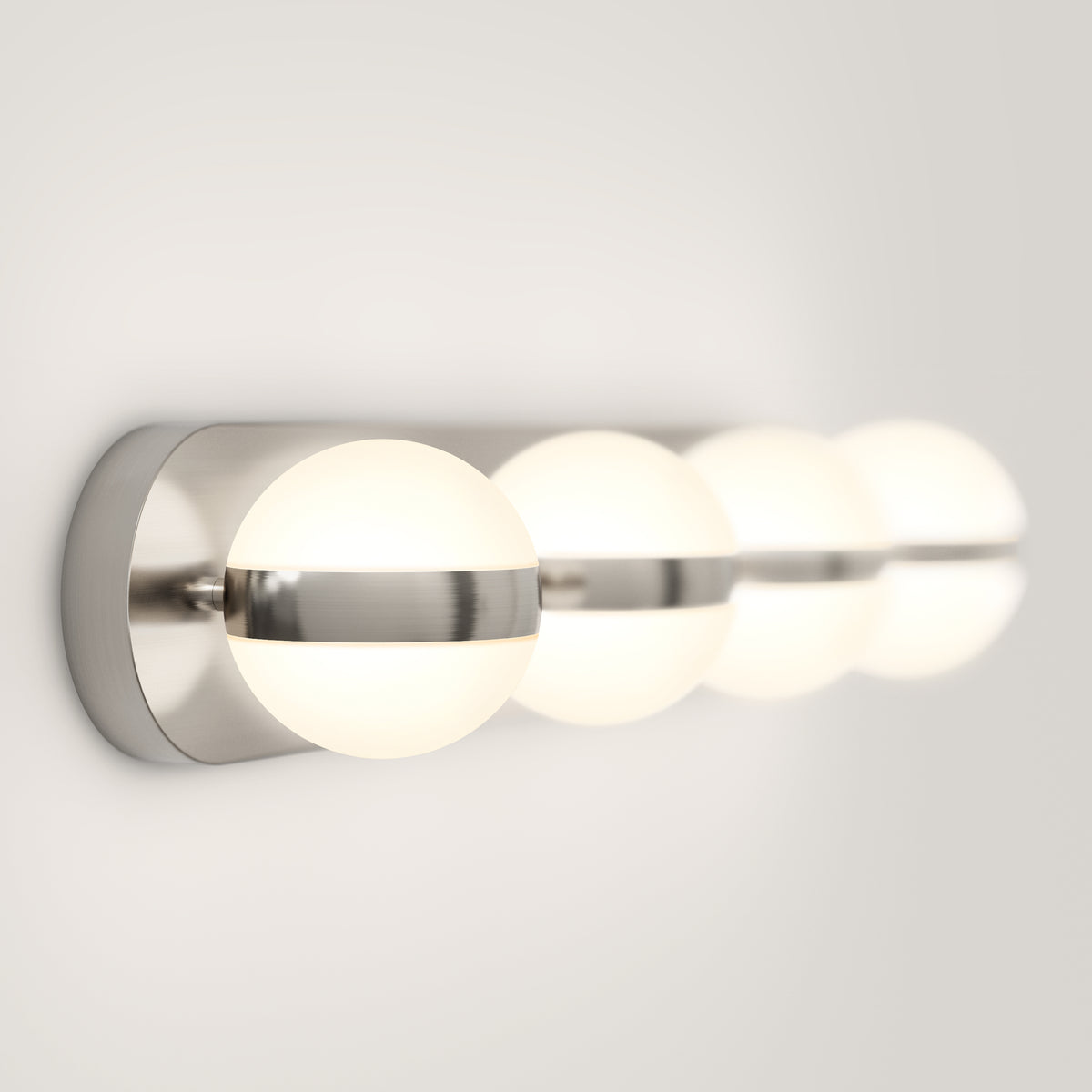 A modern wall-mounted light fixture with three glowing spherical bulbs, each encased in frosted glass and connected by a sleek, horizontal metallic bar on a white background.
