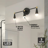 Modern matte black wall-mounted light fixture with two cone-shaped lamps, labeled as energy efficient with integrated LED and a 3-year warranty. The light is installed above a bathroom mirror.