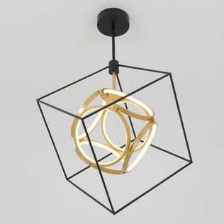 The Artika Luxury LED pendant light showcases a black metal cube frame with an abstract gold LED design inside, set against a plain white ceiling.