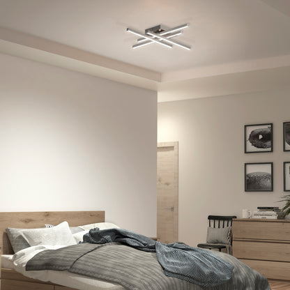 A modern bedroom features a wooden bed with gray bedding, a dresser, and monochrome wall art. The Artika Grid LED flush mount ceiling light adds unique geometric style while illuminating the neutral-colored room.