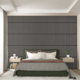 Modern bedroom with a green upholstered bed, neutral bedding, two floating nightstands with lamps, and a textured accent wall with vertical lines. A white rug covers the floor, and large windows let in natural light.