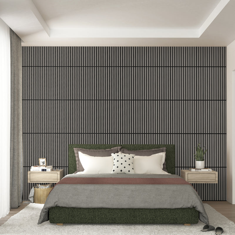 A modern bedroom features a large bed, two floating nightstands with lamps, and an Artika Sonolok 15.5 ft sound-absorbing wall panel kit (4-pack) as a textured accent wall with vertical lines behind the bed. Slippers rest near the bed.