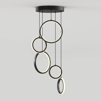 The Artika Elmo 5-light LED pendant features five illuminated rings in varying sizes, suspended at different heights from a round black base—modern design perfect against any plain white background.