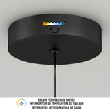 A close-up of a black ceiling light fixture with a color temperature switch and indicator, showing adjustable color temperature levels. Text below reads “Colour Temperature Switch” in English, French, and Spanish.