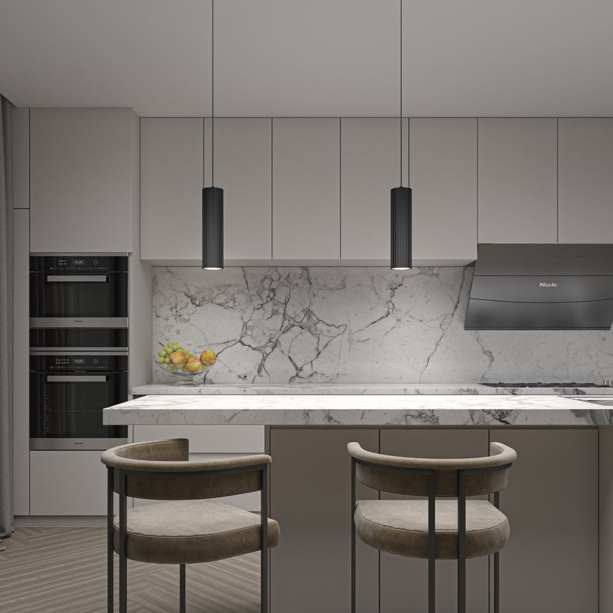 Modern kitchen with marble backsplash and island, two cushioned chairs, built-in ovens, a bowl of fruit, a sleek range hood, all in neutral tones, and the Artika Groove LED modern pendant light (3 CCT) adding contemporary style.