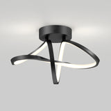 A modern ceiling light fixture with a black circular base and intertwined, curved LED light strips, creating an abstract, sculptural design against a plain white ceiling.