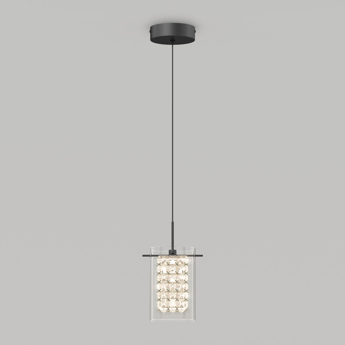 A modern pendant light fixture with a black circular ceiling mount, a long black cord, and a cylindrical glass shade filled with decorative crystals, against a plain light gray background.