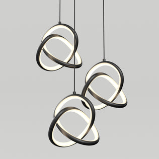 Artika’s Zephyr 3-light LED pendant features interlocking black and white illuminated rings suspended against a plain light gray background, delivering a contemporary, artistic look.
