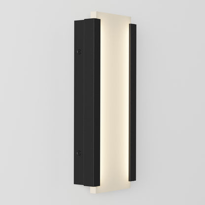 The Artika Blade indoor-outdoor LED wall light features a modern rectangular vertical design with a central frosted panel and two black metal side panels, shown mounted on a light-colored wall.