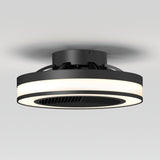 A modern, black ceiling fan with an integrated circular LED light, mounted on a white ceiling. The fan has a sleek, minimalist design and a vent-like center.