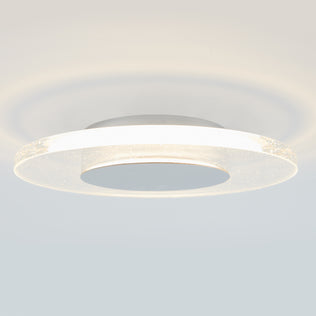 The Artika Essence Disk LED flush mount features a glowing white ring and central disc for a soft halo effect, delivering contemporary elegance and modern style to any room with its ceiling-mounted design.