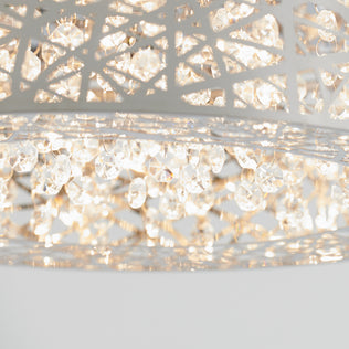 Close-up of the Artika Crystal Nest LED flush mount, featuring intricate metalwork and sparkling crystals illuminated by warm LEDs for a bright, elegant atmosphere.