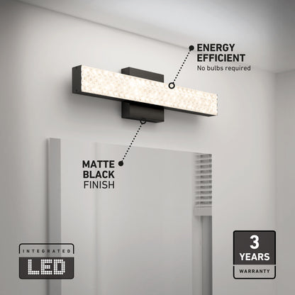 The Artika Adeline modern LED bathroom vanity light 3 CCT, in matte black, is mounted above a mirror; labels highlight its energy efficiency, integrated LED, matte black design, and 3-year warranty.