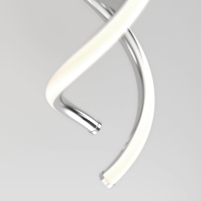 A close-up of two intertwined, spiral metal tubes against a plain, light background. One tube is shiny silver, and the other appears to be covered with a soft, white material.